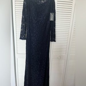 Navy blue size 12 long sleeve evening beaded gown.
